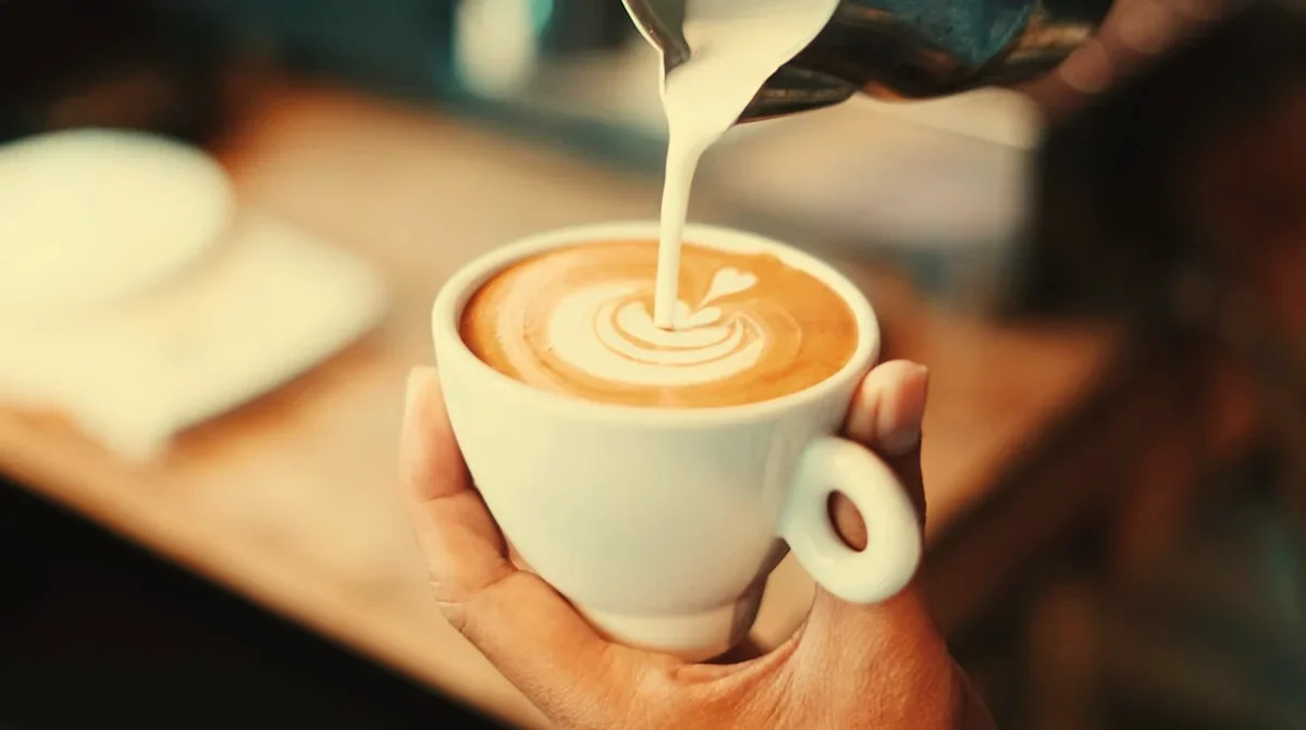Espresso coffee swirled with creamy condensed oat milk
